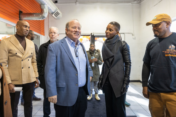 Mayor Mike Duggan admires Our Community Laundromat with owner LaCesha Brintley