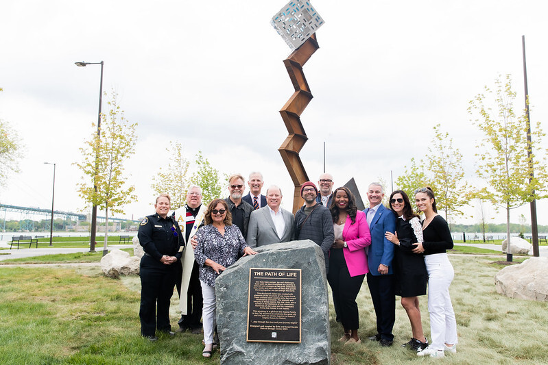 Mayor Duggan, the Nordin Brothers, Adamo Group and City team in front of Riverside Park newest sculpture.  