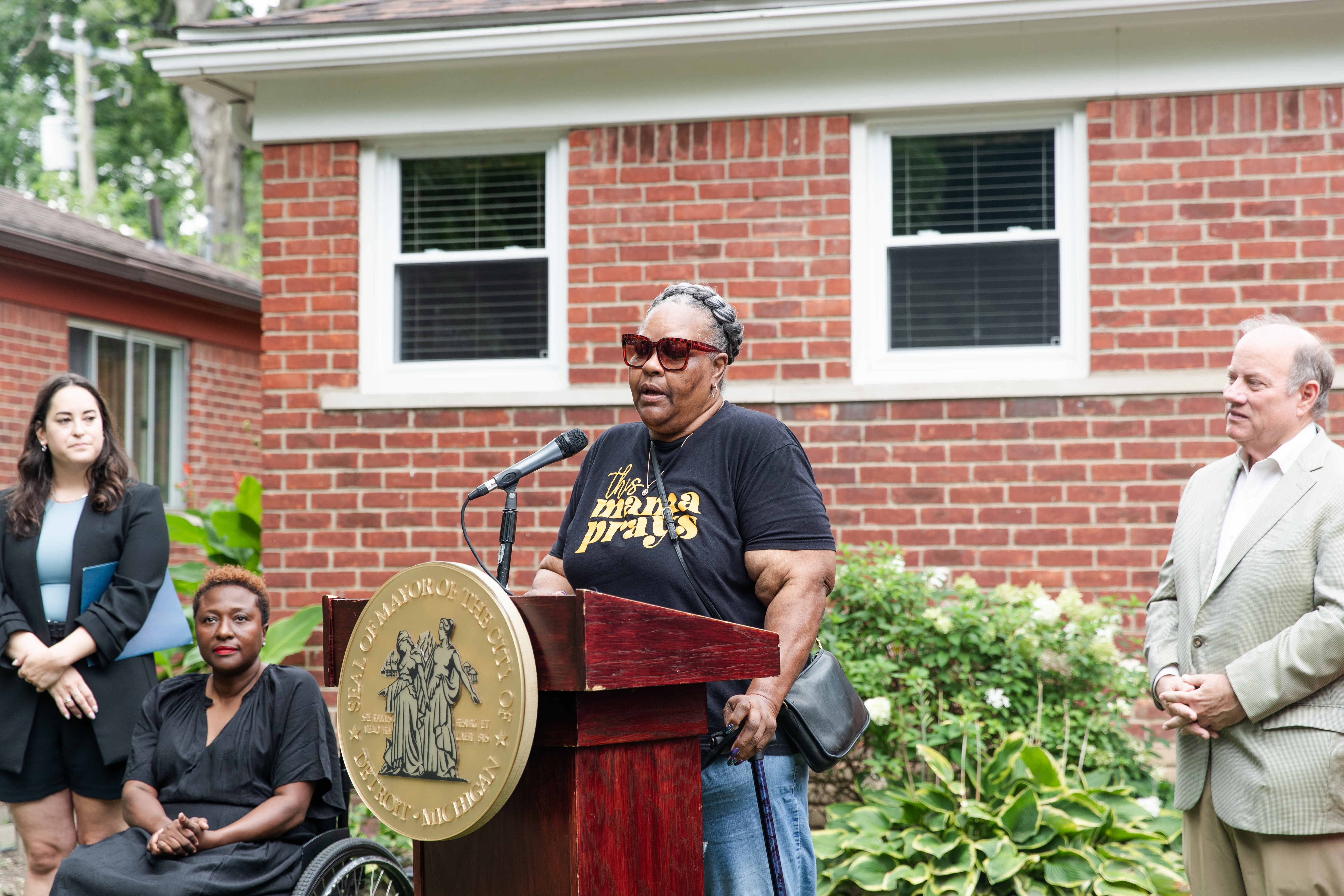 Detroit Home Accessibility recipient speaking at podium