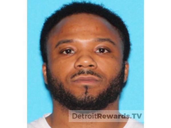 Suspect Damion Fryer. Male with a black beard and moustache, short black hair.