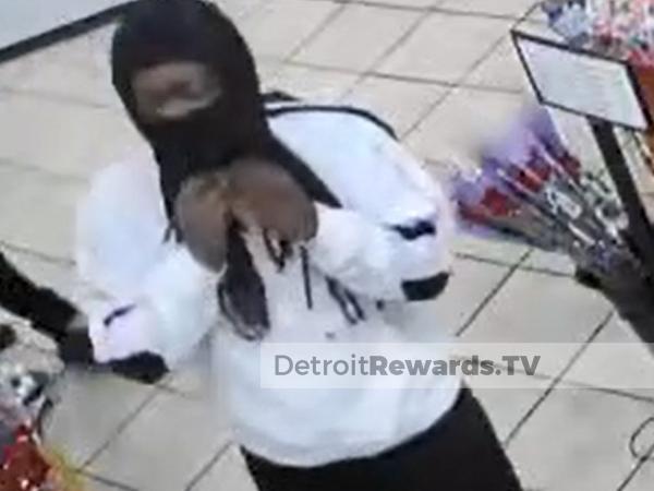 Male suspect wearing a black balaclava mask, white sweatshirt and black pants.